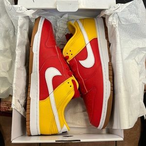 Nike dunk size 11 M red with yellow.  Gum bottom red laces